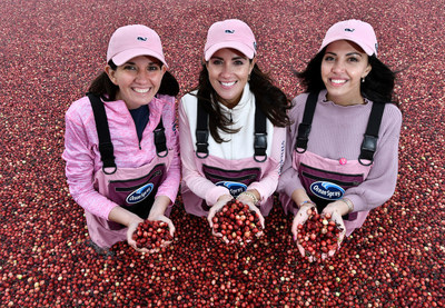 From left, Katie Thiede, CEO of Bright Pink, Nicole Sutliff, Senior Director of Public Relations at vineyard vines, and Christina Ferzli, Head of Global Corporate Affairs at Ocean Spray, announce their joint partnership with a pink cranberry harvest at a cranberry bog in Rochester, Mass. on Wednesday, Sept. 18. (Josh Reynolds/AP Images for Ocean Spray)