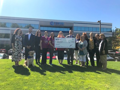 PenFed employees, leadership and PenFed Northwest Battle Buddies service dog in training Journey pictured with S.A.R.A.’s Treasures staff.