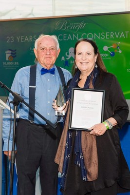 Board of Director's Member Ed Ueber, presenting the Bay Hero of the Year Award to Felicia Marcus.