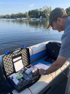 Dr. Moshe Harel, BlueGreen Water Technologies CTO, testing cyanobacteria-free water at Chippewa Lake this week, result of successful treatment conducted weeks ago