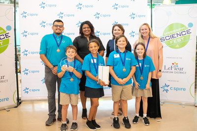 Back row (left to right) C Spire mentor Martin Guzman, C Spire CTO Carla Lewis, Mississippi Children's Museum President and CEO Susan Garrard and teacher Kelly Edwards are all smiles as they celebrate with the winning Madison Ridgeland Academy team in the second annual C Spire C3 Jr. 2019 coding challenge. Front row (left to right): 4th grade students Johhny Fondren, Kennedy High, Sharps Vance and Memary Yates (team members) Back row (left to right) C Spire mentor Martin Guzman, C Spire CTO Carla Lewis, Mississippi Children's Museum President and CEO Susan Garrard and teacher Kelly Edwards are all smiles as they celebrate with the winning Madison Ridgeland Academy team in the second annual C Spire C3 Jr. 2019 coding challenge. Front row (left to right): 4th grade students Johhny Fondren, Kennedy High, Sharps Vance and Memary Yates (team members)